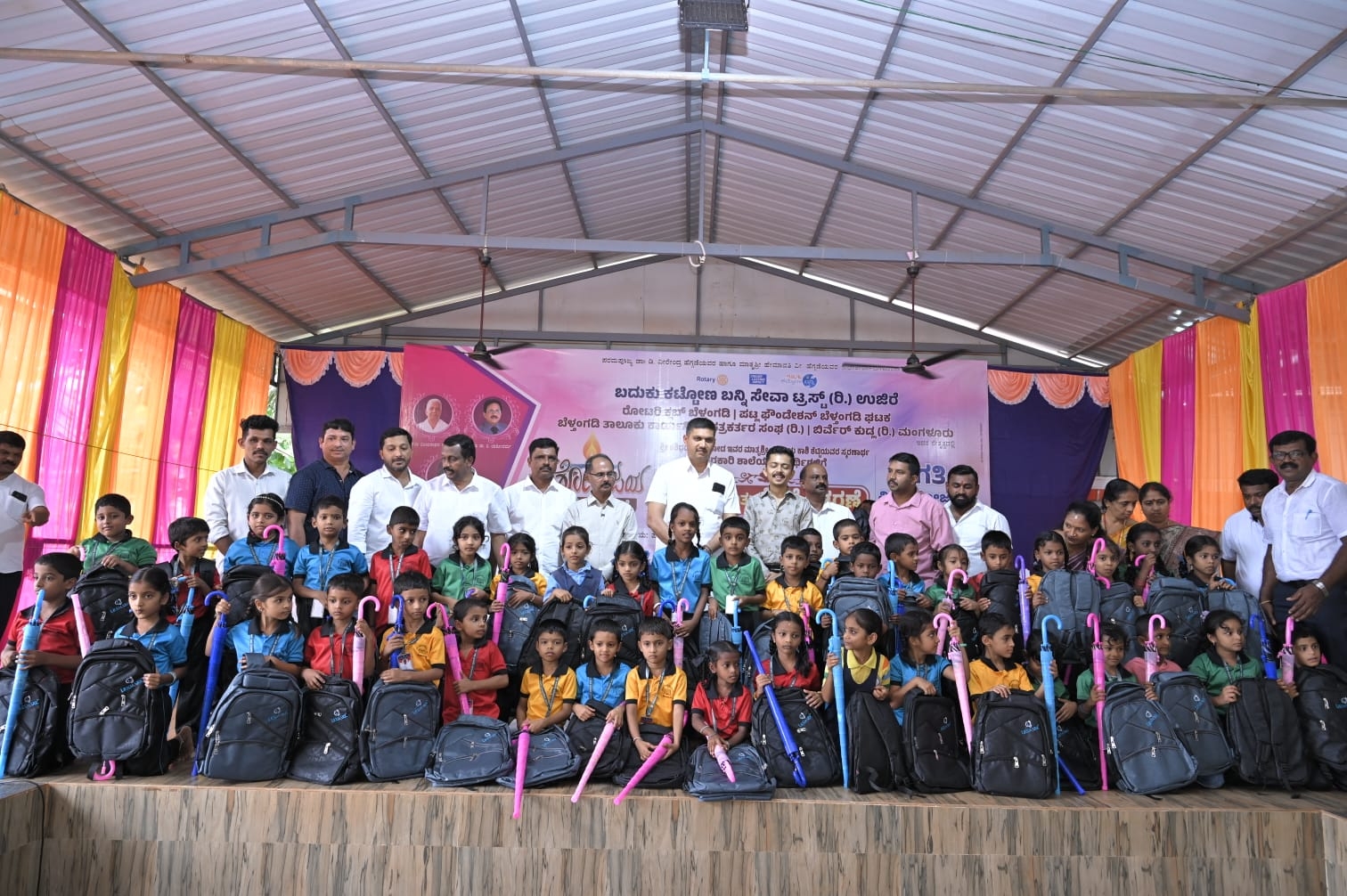 Distribution of  bags, umbrellas to Primary school students