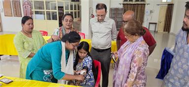 fitting of Prosthetic hand to a girl student
