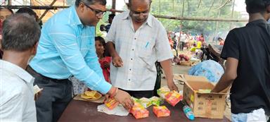 DISTRIBUTION OF SWEET PACKETS AND WATER BOTTLES