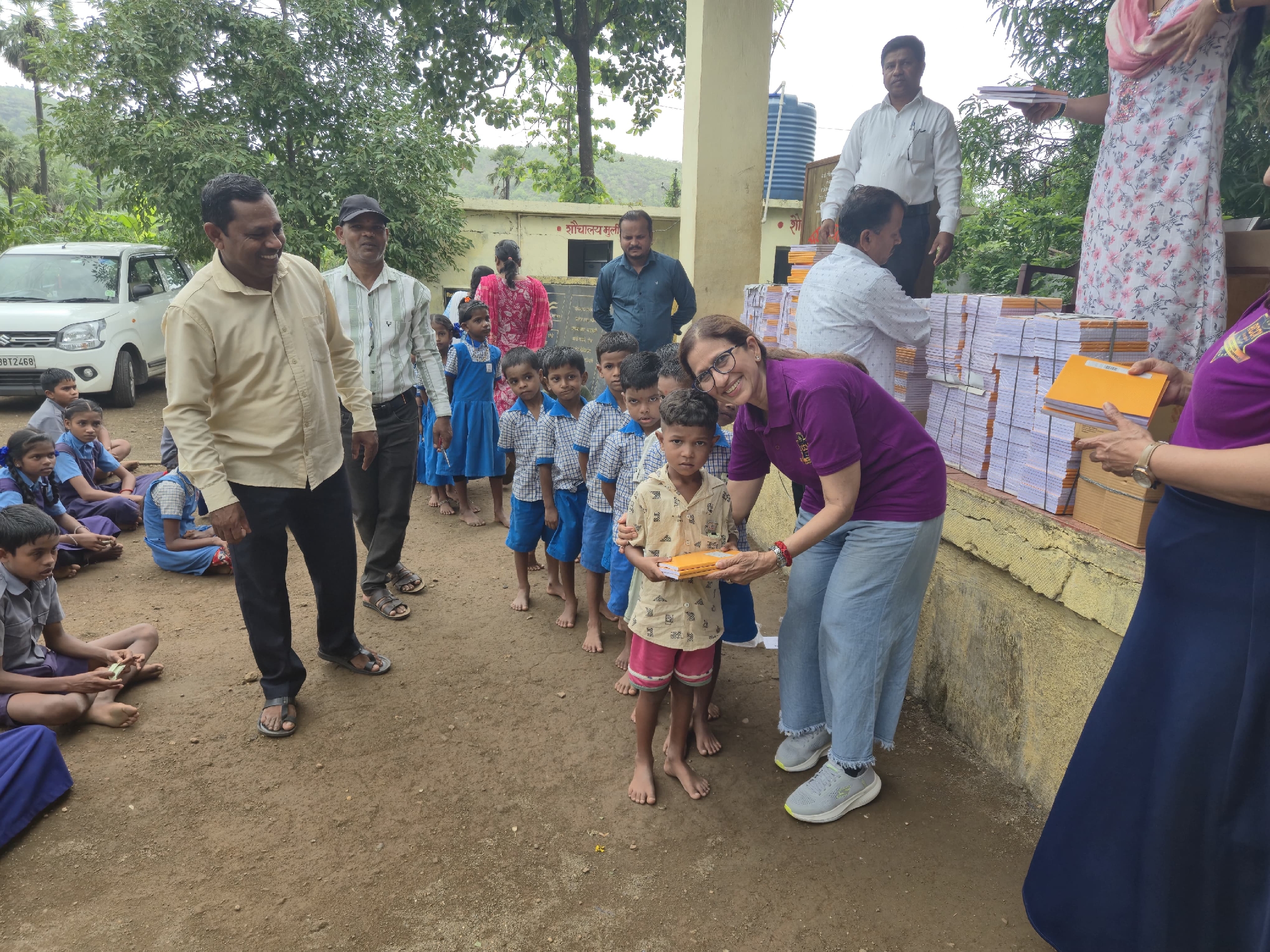Note Book Distribution tochilderen in Pole School