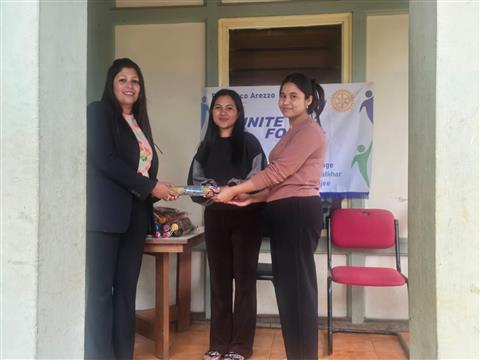 Community Outreach- Distribution of Umbrella