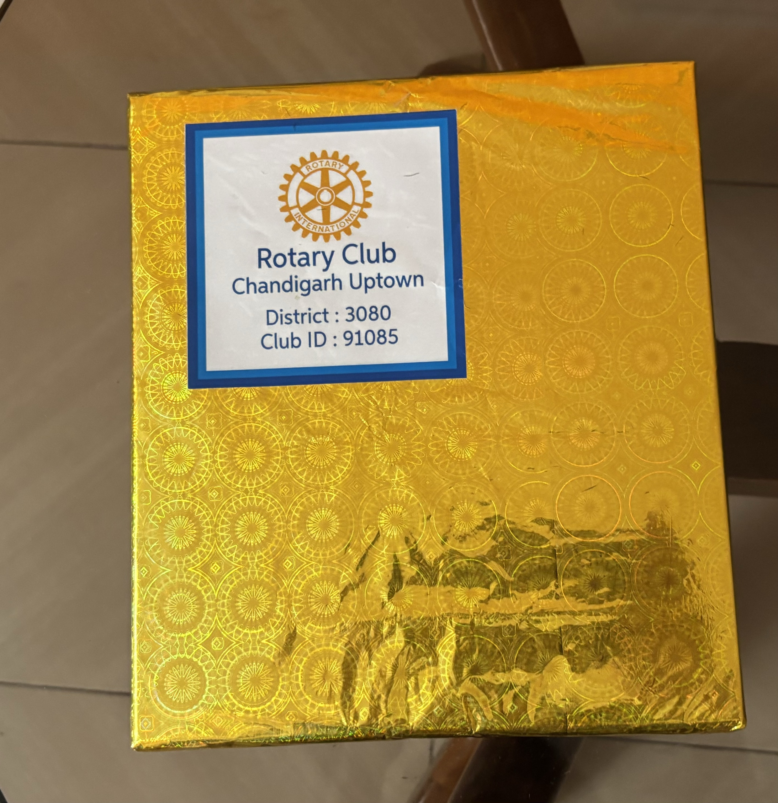 Presented mementos with stickers bearing Rotary logo and name of our club
